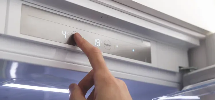 hand-setting-refrigerator-temperature